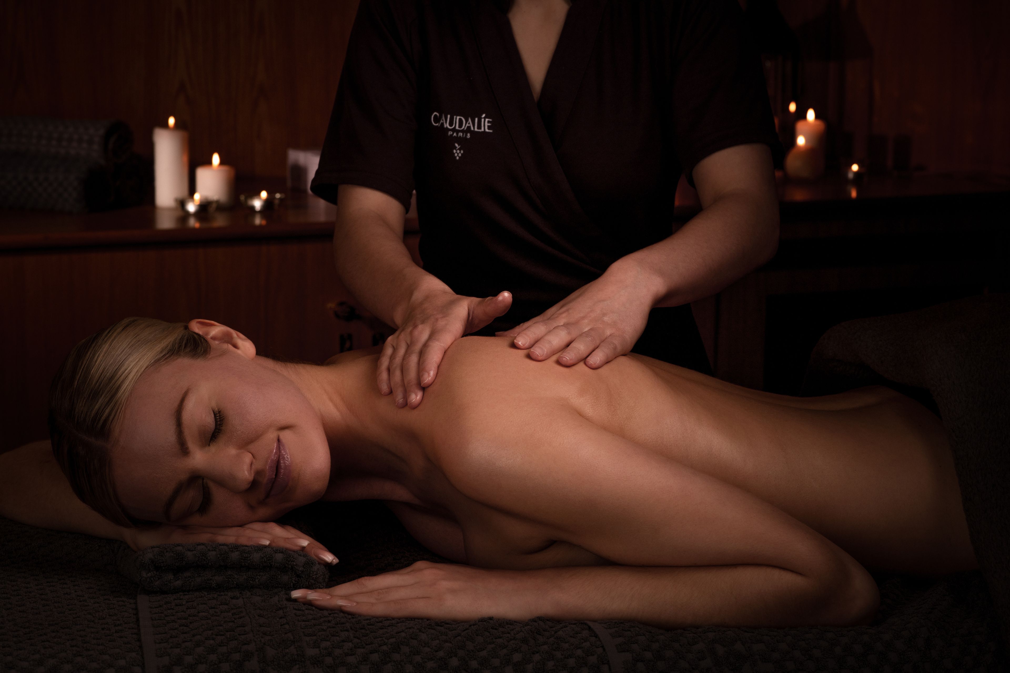 person receiving a massage on a spa table