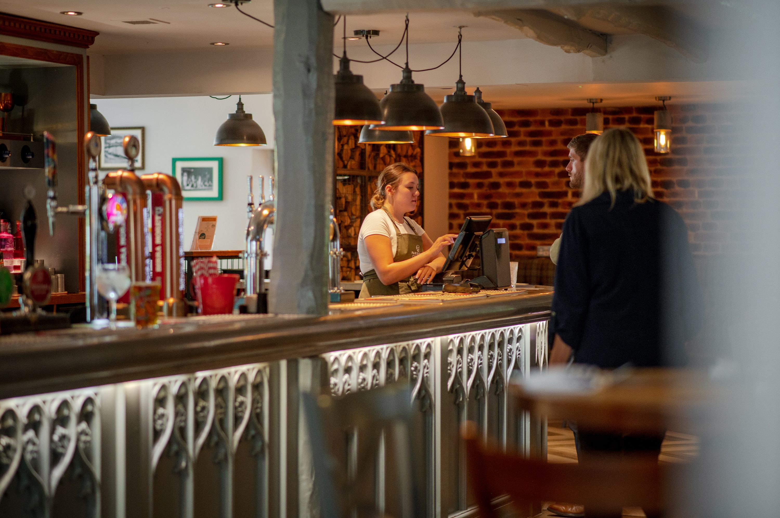 waitress taking orders in a bar