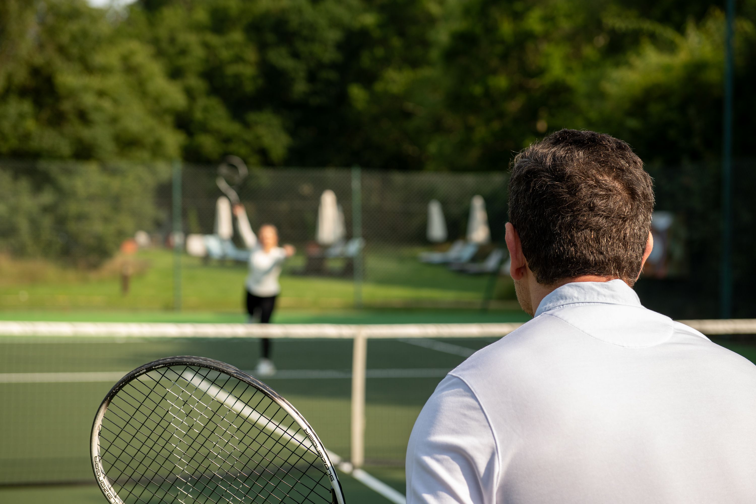 two people playing tennis