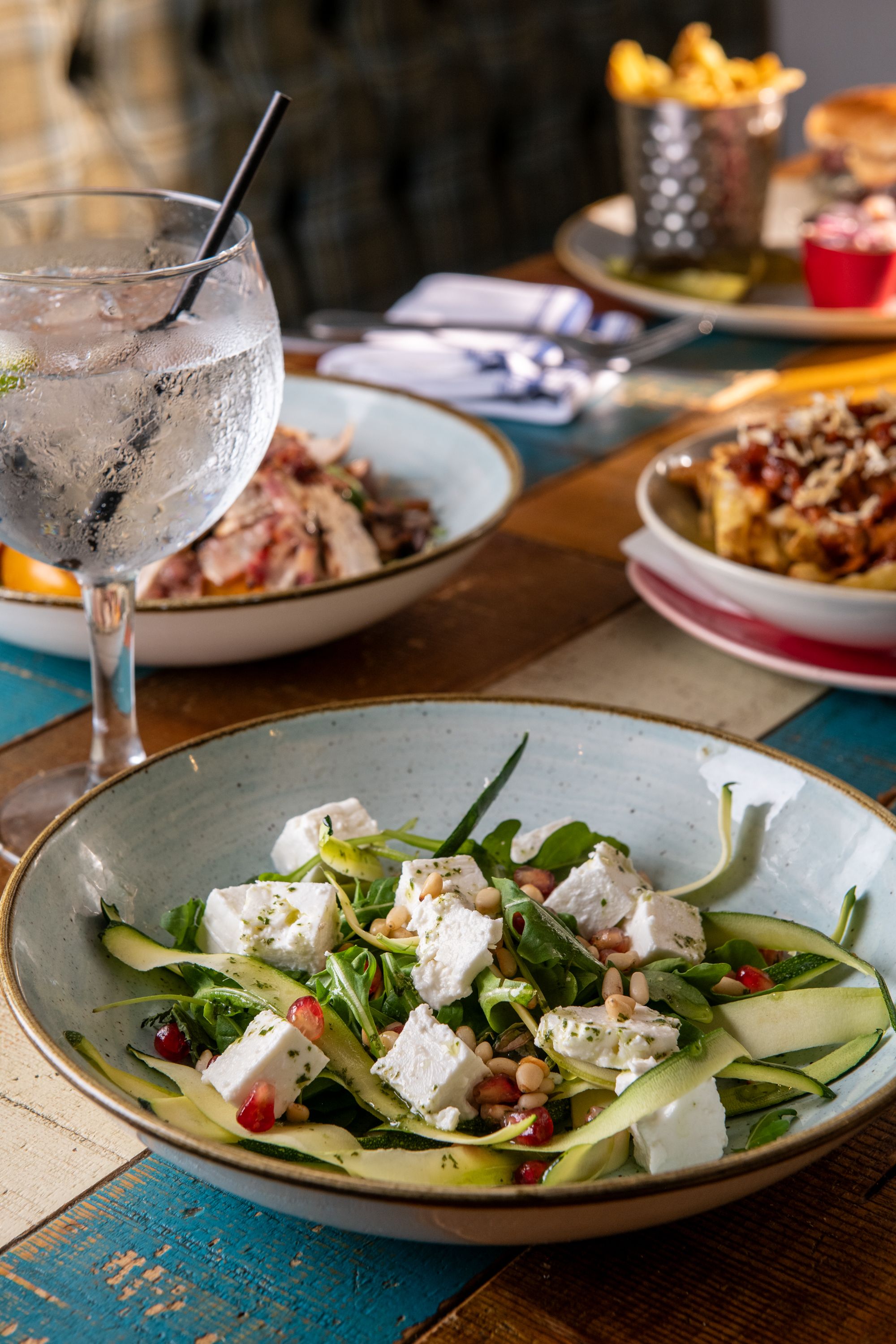 salad with feta, zucchini, and pomegranate seeds