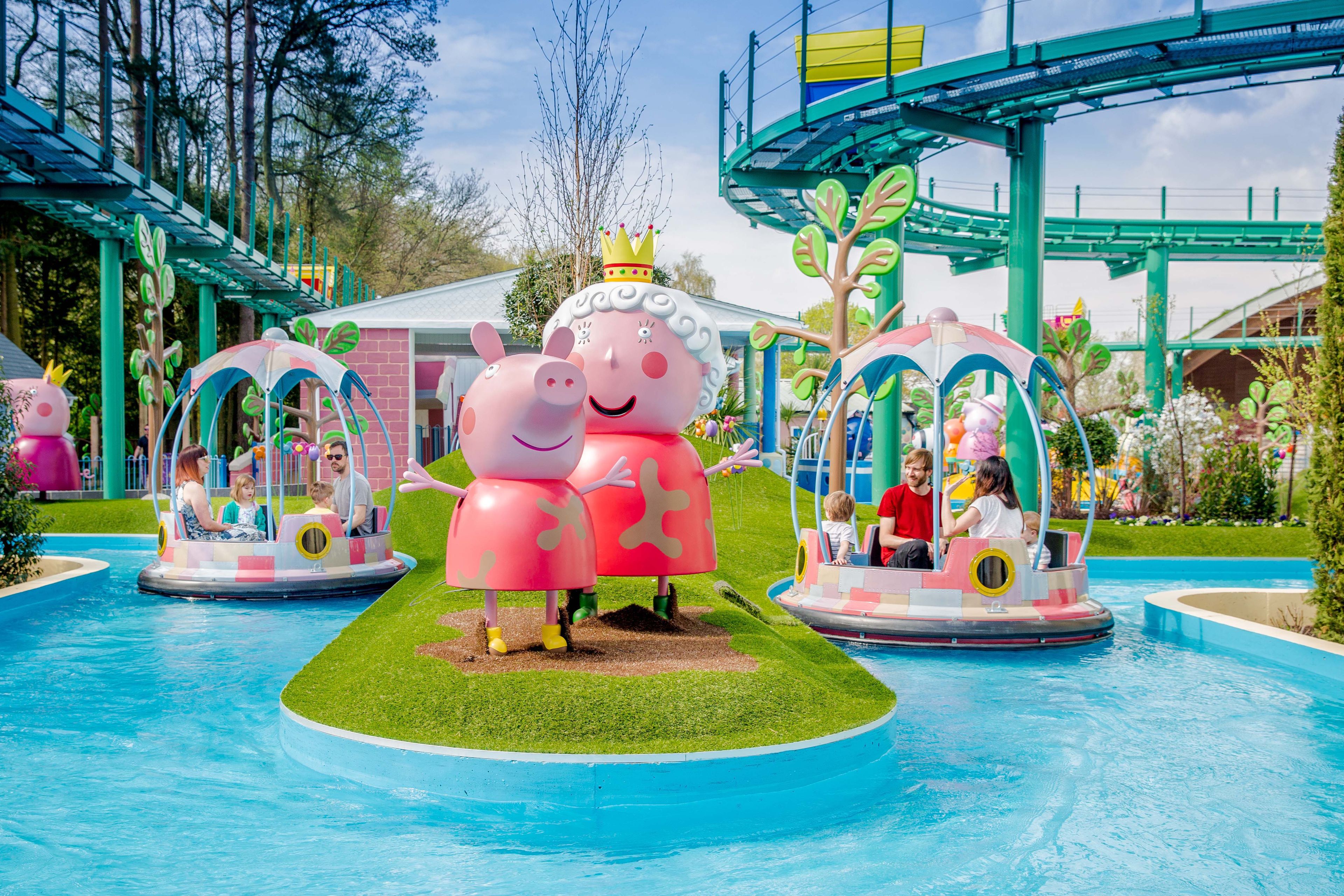 people on a Peppa Pig water ride at an amusement park