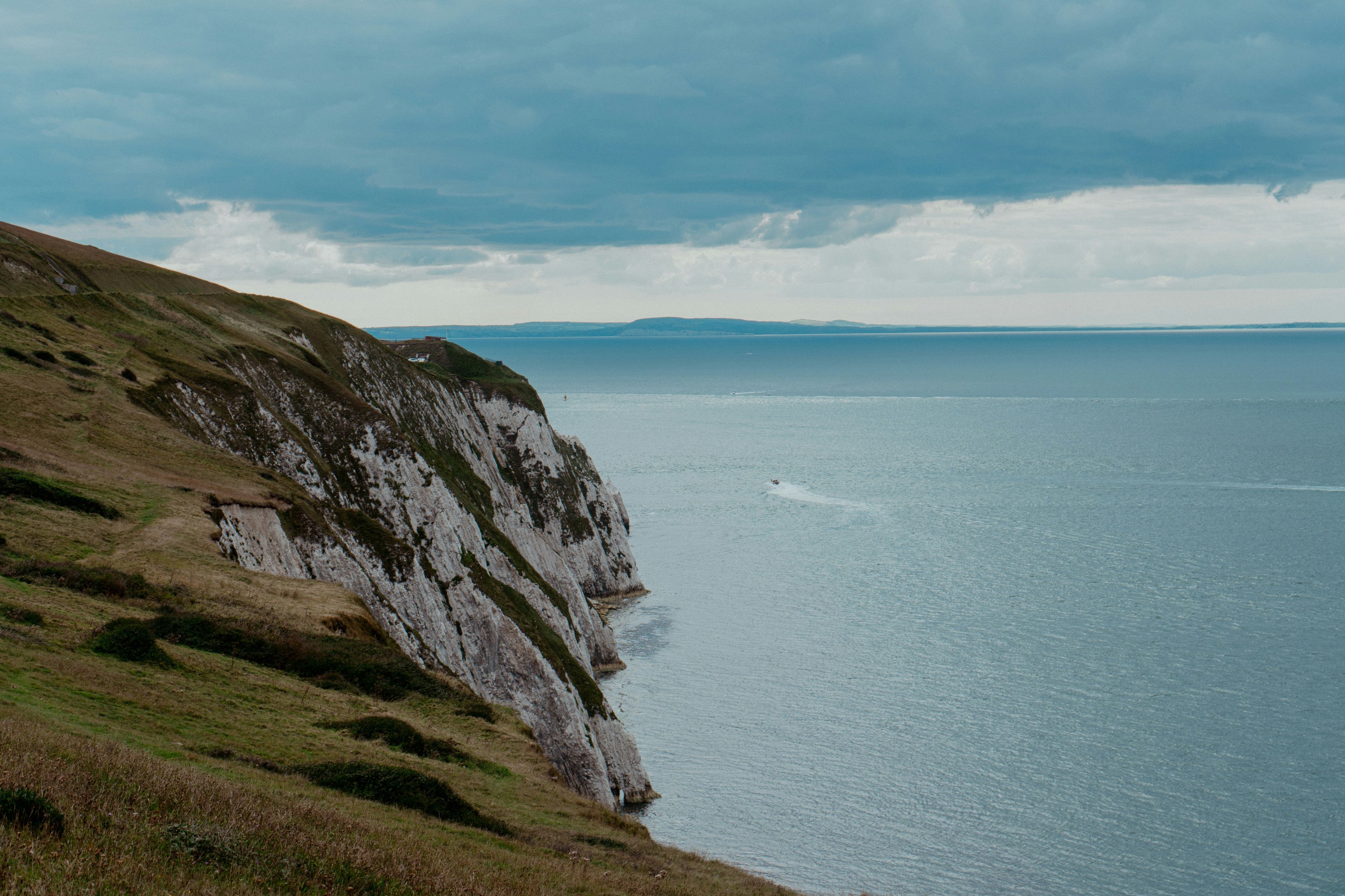 coastal landscape with a cliff edge and a body of water