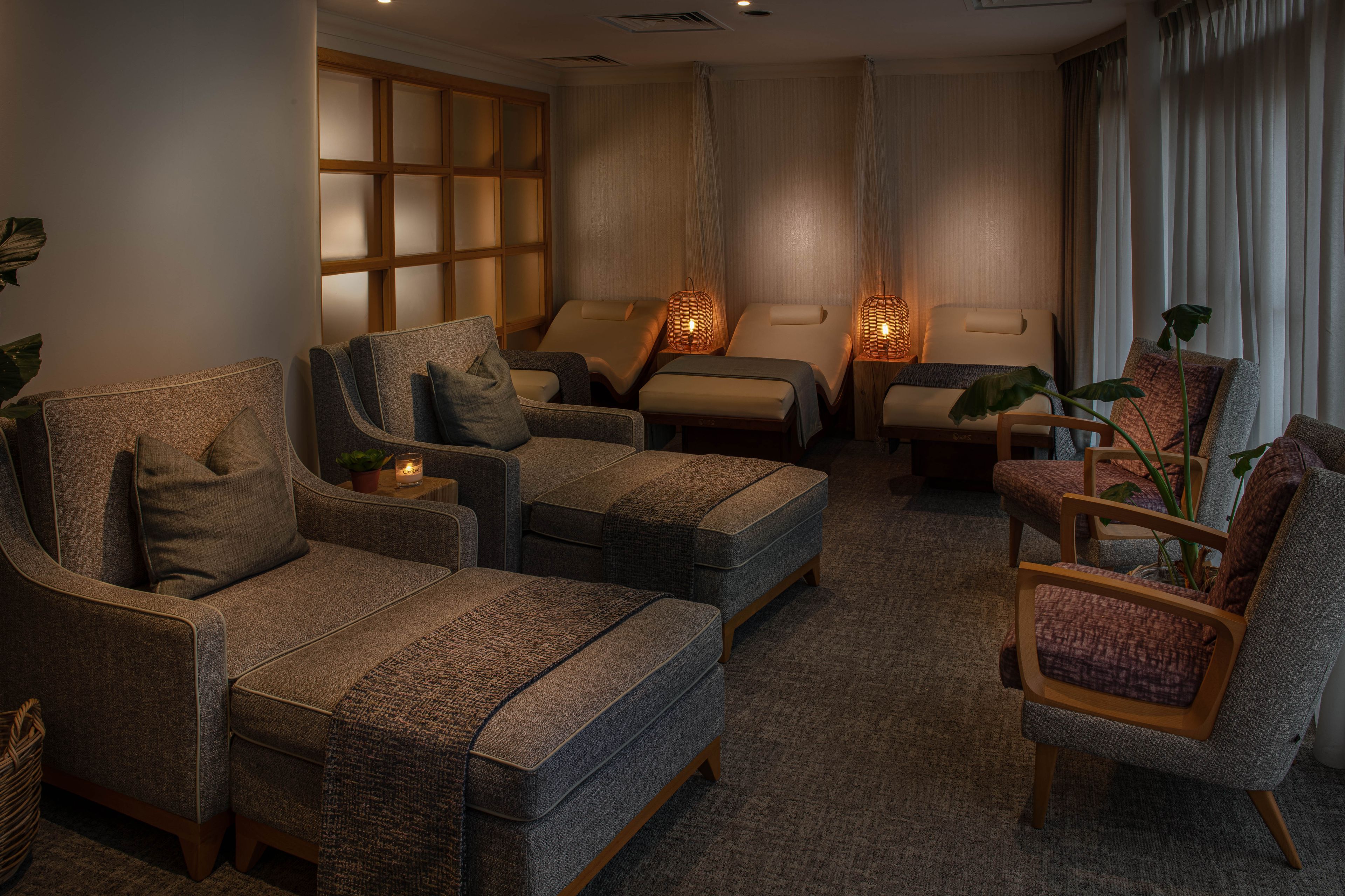 relaxing spa room with lounge chairs