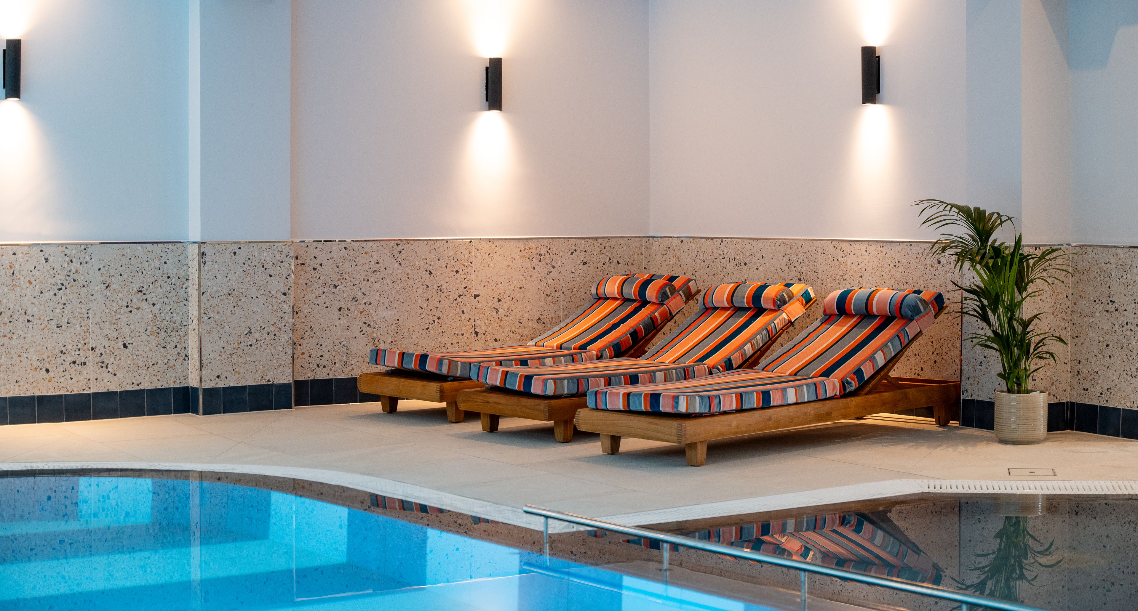 lounges by swimming pool