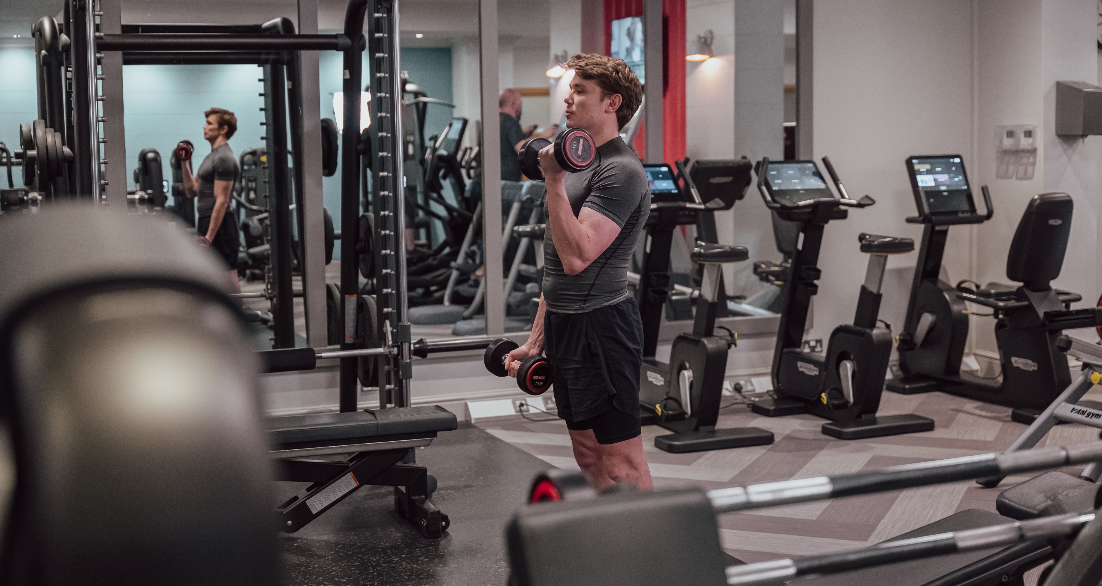 man lifting weights in the gym