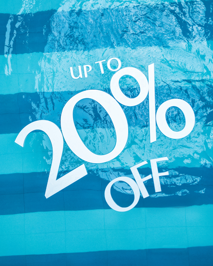 Floats in spa pool that read "Up to 20% off"